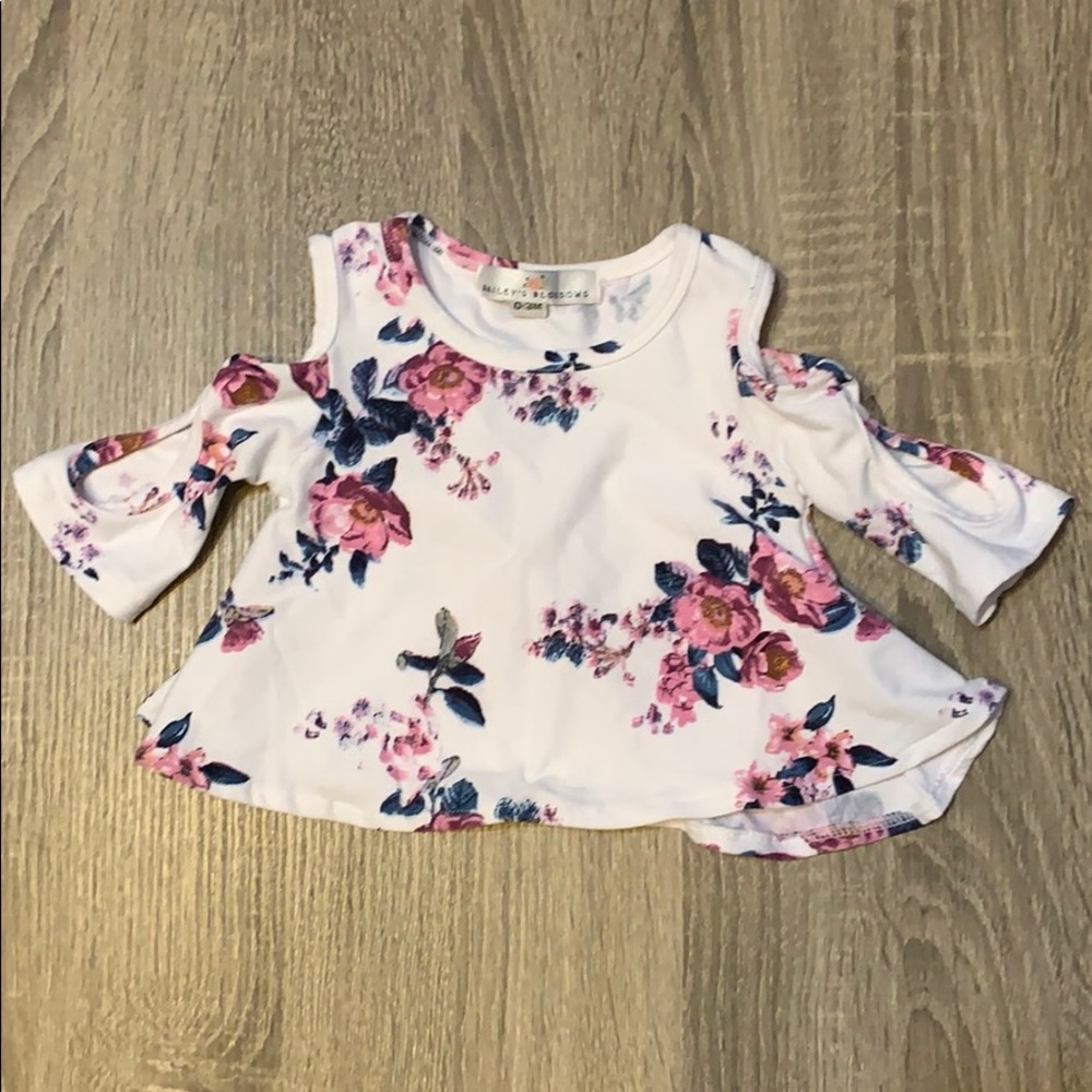 Floral cold shoulder infant shirt.